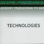 Zarządzanie urządzeniami w firmie – komputery i tablety w biurze z monitorami bezpieczeństwa